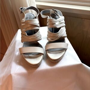 Adjustable heel strap platform sandals. Cloth heel and platform leather upper
